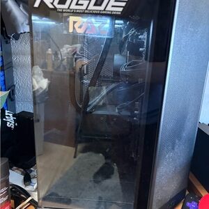 Next Black Gaming pc with two monitors, a gaming chair, razer keyboard, and mic